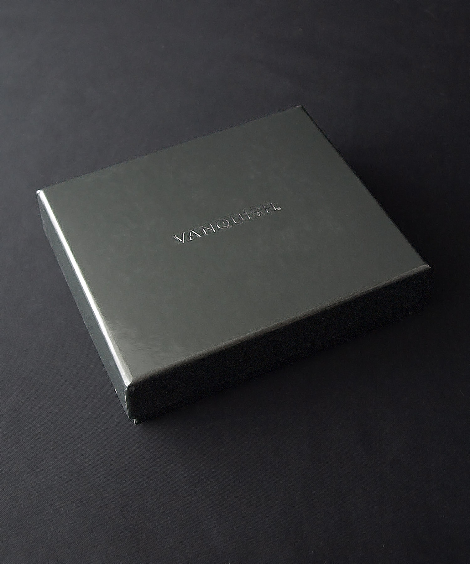 ﾗﾑ革編込み二つ折り財布